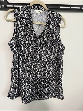 Black and white sleeveless blouse